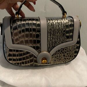 Elegant Croc-Embossed Black and Gold Handbag